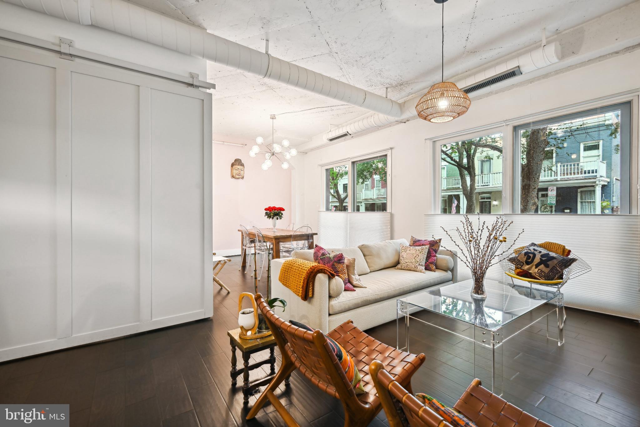 1700 Kalorama Road Northwest, Unit 207 Washington, DC 20009 - Photo 6 of 40 a living room with furniture and a large window