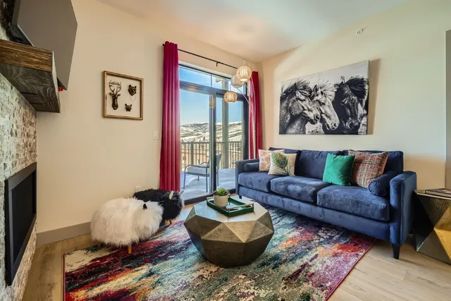 a living room with furniture and a rug