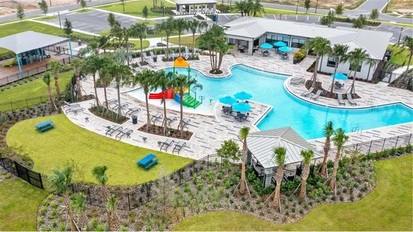 a view of swimming pool with outdoor seating