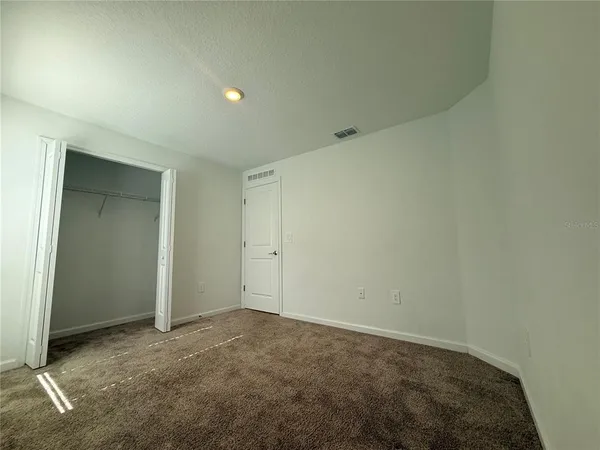 an empty room with closet