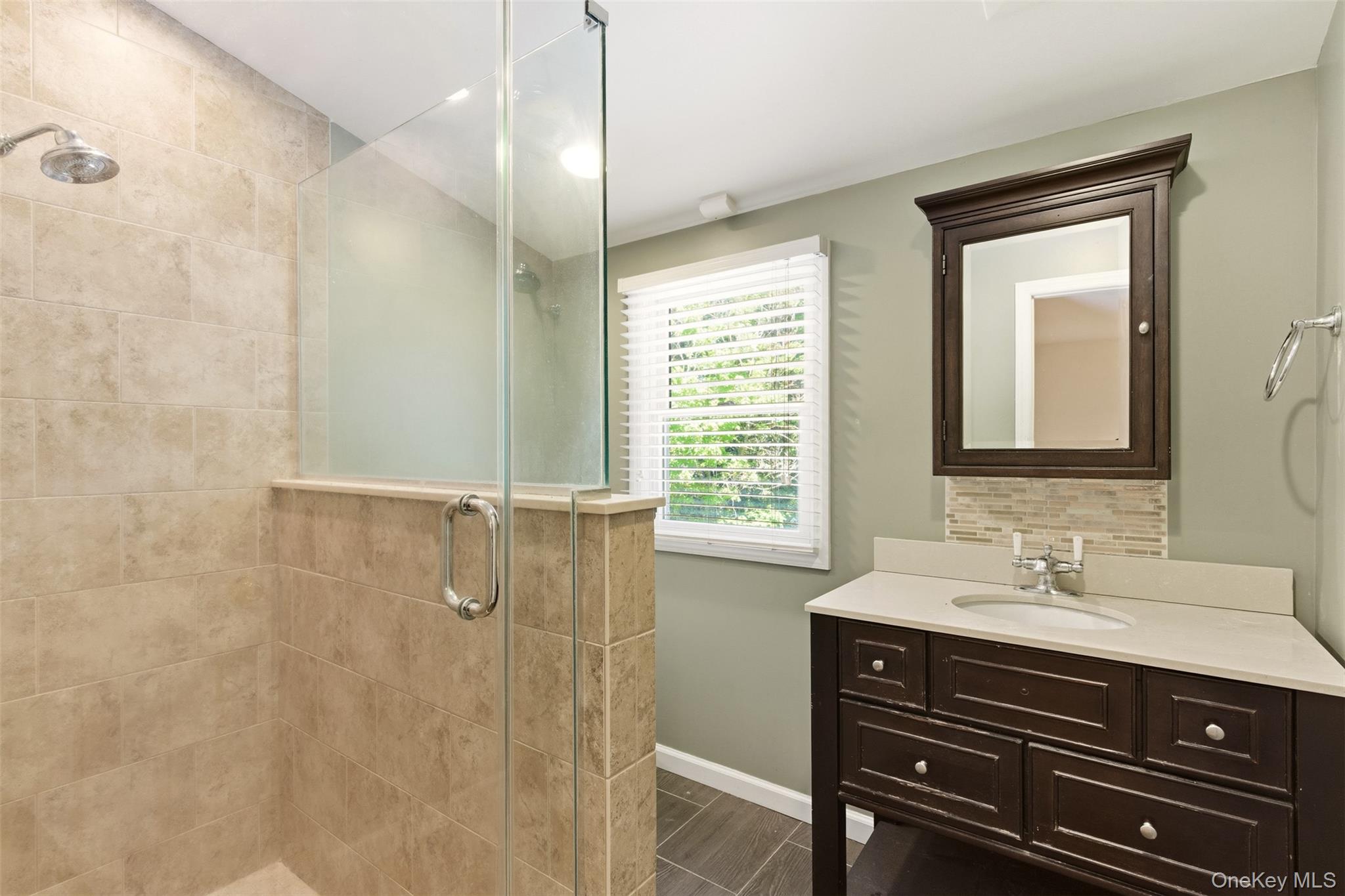 106 Vineyard Road Huntington, NY 11743 - Photo 20 of 25 a bathroom with a sink a vanity and a mirror