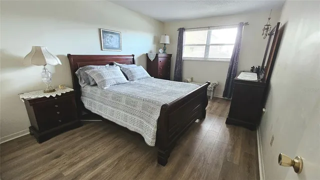 a bed room with a bed and a window