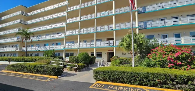 a view of a potted plants and a bench in front of a building