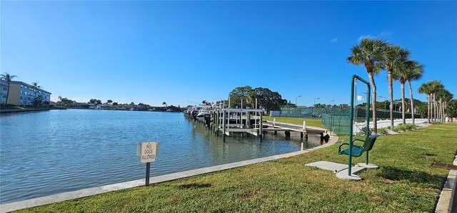 a view of a swimming pool with a yard