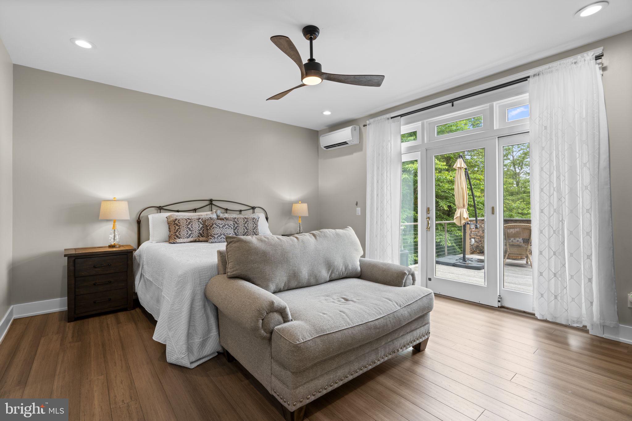 798 Creek View Road Severna Park, MD 21146 - Photo 21 of 72 a bedroom with a bed and wooden floor