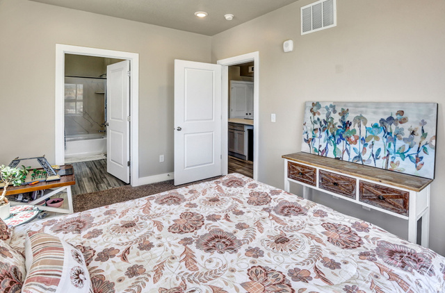 2101 North Main Street, Unit 306 Sunset, UT 84015 - Photo 12 of 22 Carpeted room with neutral wall tones and white trim