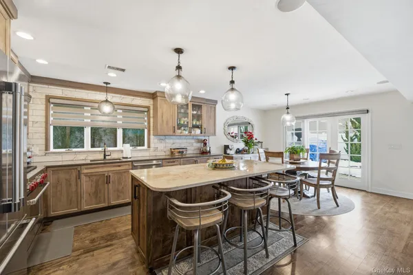 a kitchen with a table and chairs in it