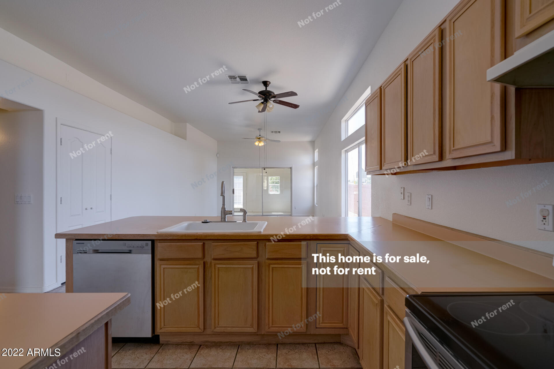 17648 North 17th Street Phoenix, AZ 85022 - Photo 11 of 31 a kitchen with a sink cabinets and window