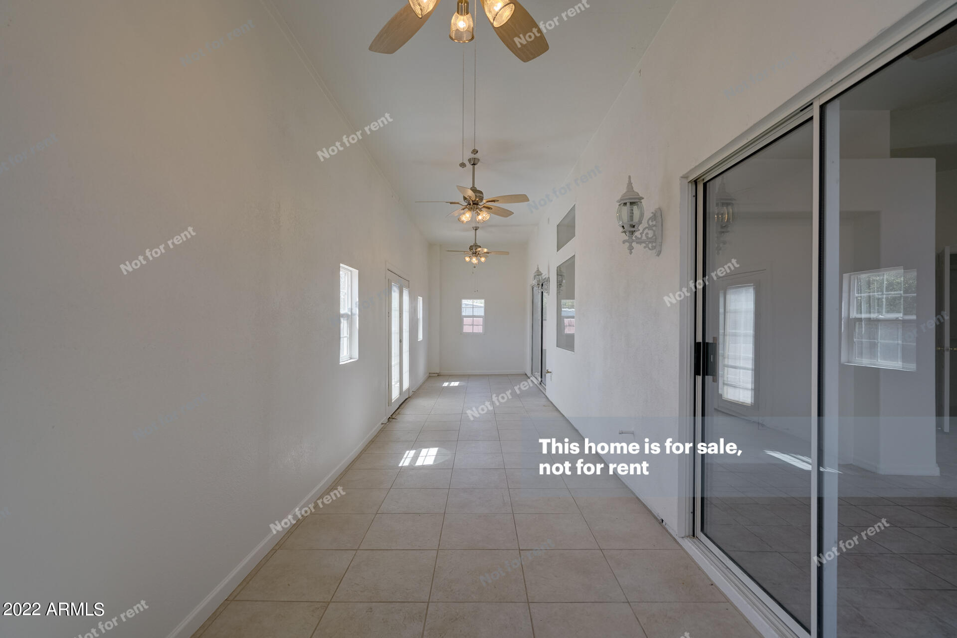 17648 North 17th Street Phoenix, AZ 85022 - Photo 15 of 31 a view of a hallway with chandelier fan and glass door