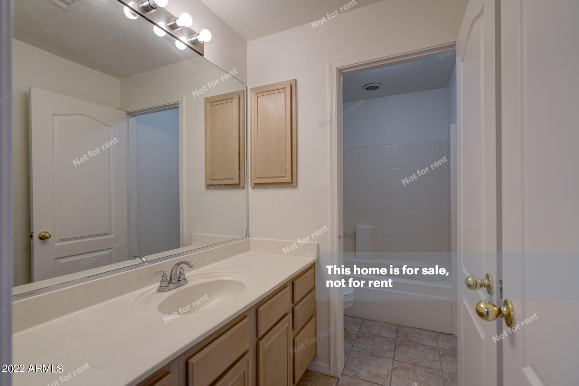 17648 North 17th Street Phoenix, AZ 85022 - Photo 27 of 31 a bathroom with a sink and a mirror