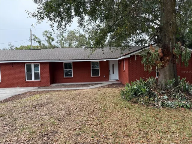 a house with trees in the background