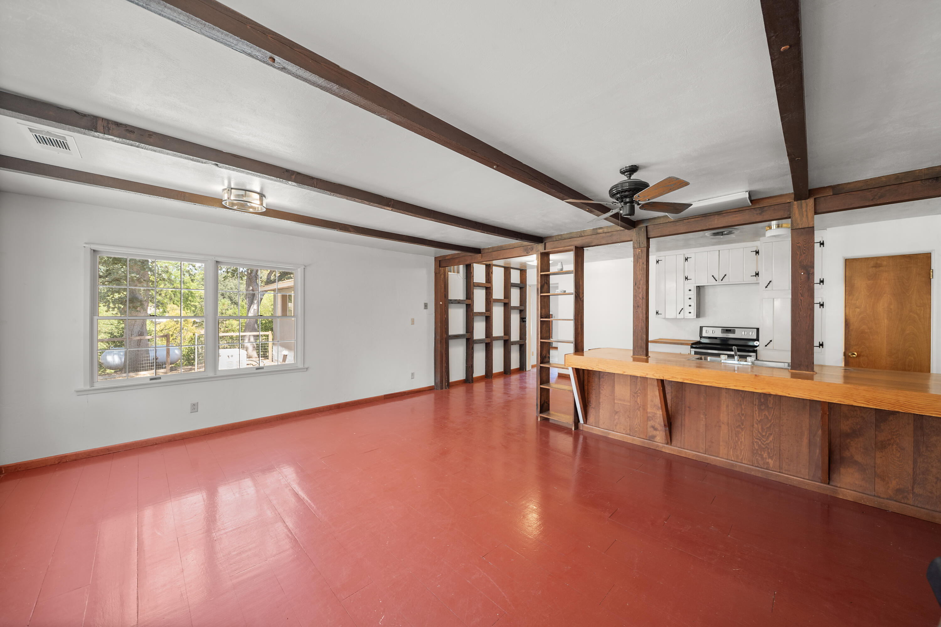 14575 Kinney Avenue Red Bluff, CA 96080 - Photo 13 of 43 a view of an empty room with window and wooden floor