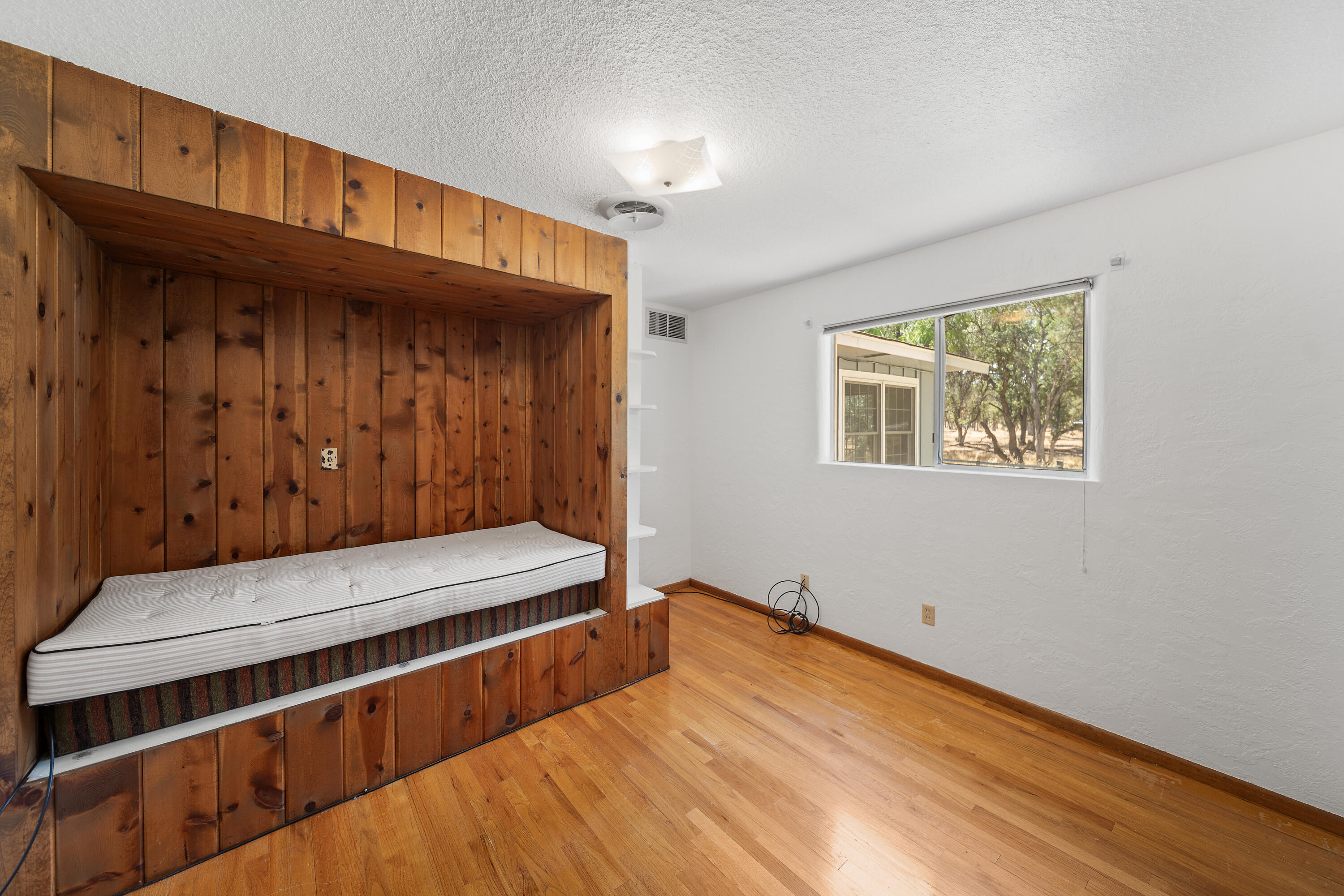 14575 Kinney Avenue Red Bluff, CA 96080 - Photo 16 of 43 a view of room with wooden floor