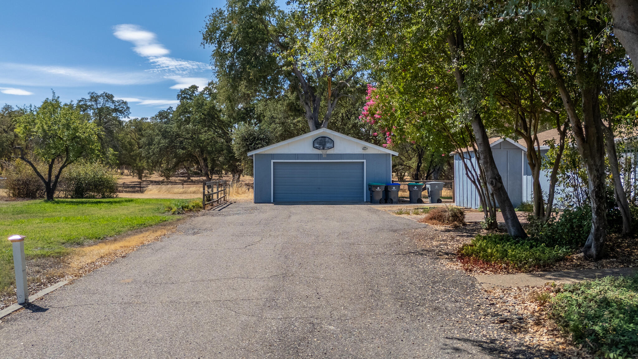 14575 Kinney Avenue Red Bluff, CA 96080 - Photo 6 of 43 a front view of a house with a yard and garage