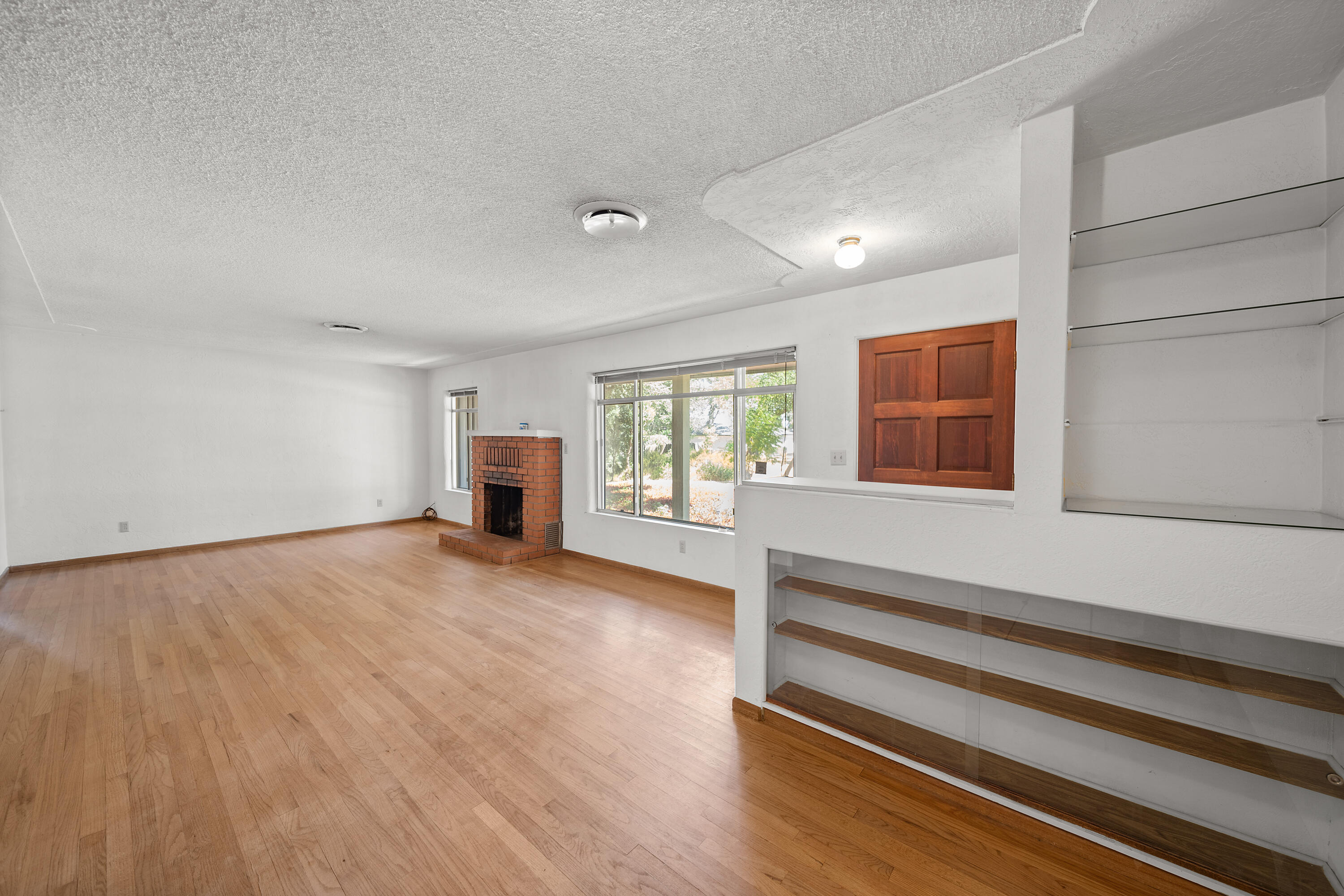 14575 Kinney Avenue Red Bluff, CA 96080 - Photo 10 of 43 a view of empty room with wooden floor and fan