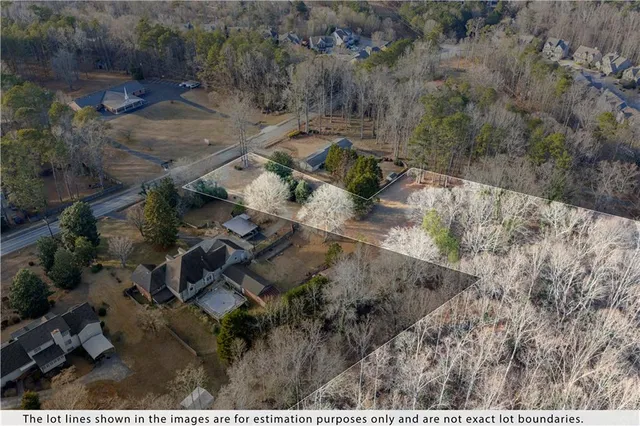 an aerial view of residential house with outdoor space
