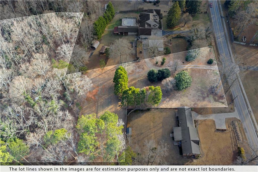 0 South Hurt Road Southwest Smyrna, GA 30082 - Photo 9 of 10 an aerial view of a house with a yard and a large tree