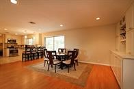 7622 Richmond Avenue Houston, TX 77063 - Photo 4 of 9 a view of a dining room with furniture and chandelier