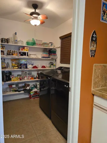 a kitchen with stainless steel appliances granite countertop a refrigerator and a stove