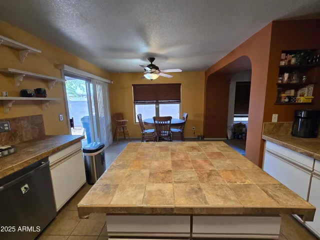 a kitchen with a stove and a refrigerator