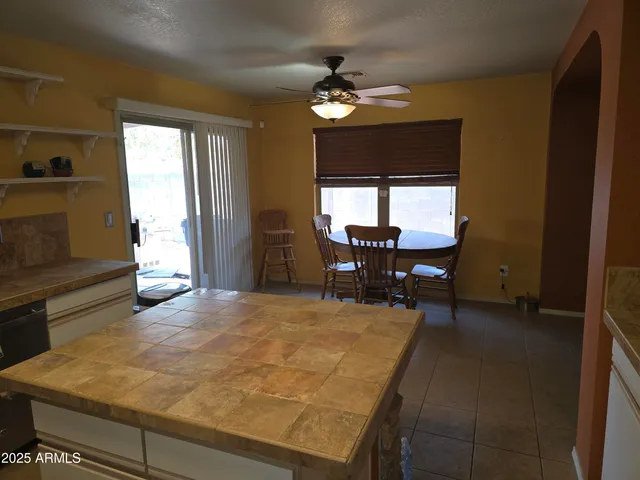 a kitchen with stainless steel appliances a stove a microwave a sink and cabinets