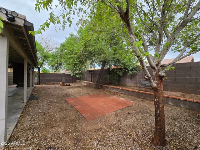 a backyard of a house with lots of green space