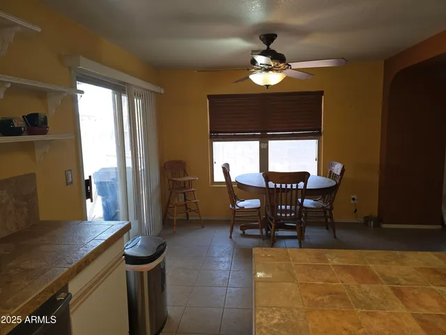 a kitchen with a stove and a refrigerator