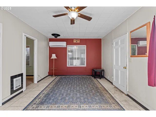 a view of an empty room with a window