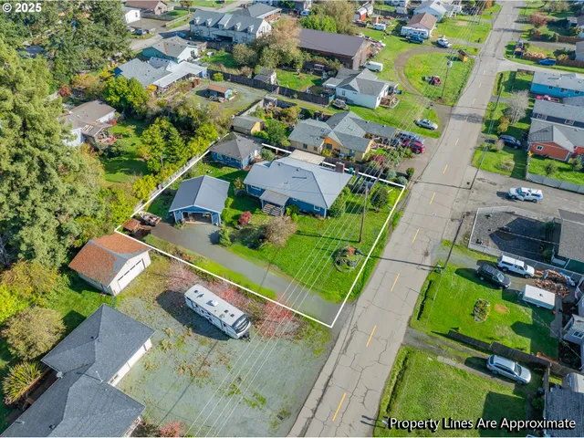 an aerial view of a house a yard basket ball court and outdoor seating
