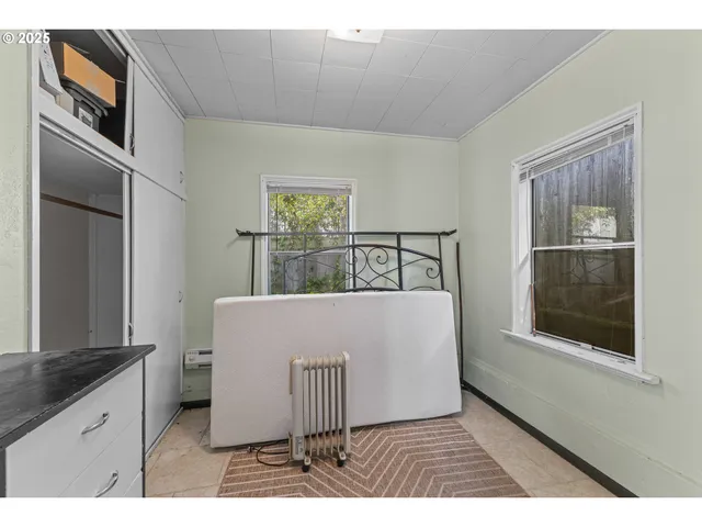a view of kitchen with cabinets