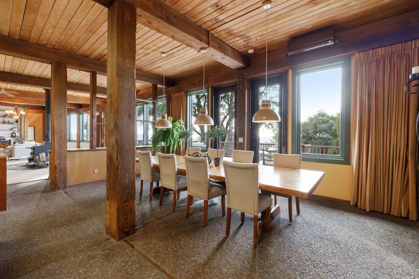 13456 Indian Trail Road Los Gatos, CA 95033 - Photo 27 of 99 a view of a dining room with furniture wooden floor and a potted plant