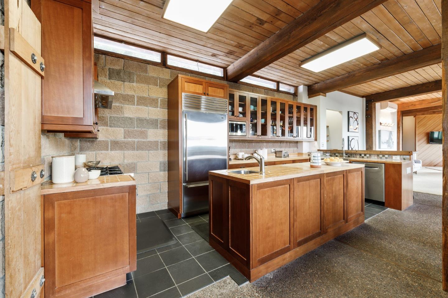 13456 Indian Trail Road Los Gatos, CA 95033 - Photo 28 of 99 a kitchen with a stove and a refrigerator