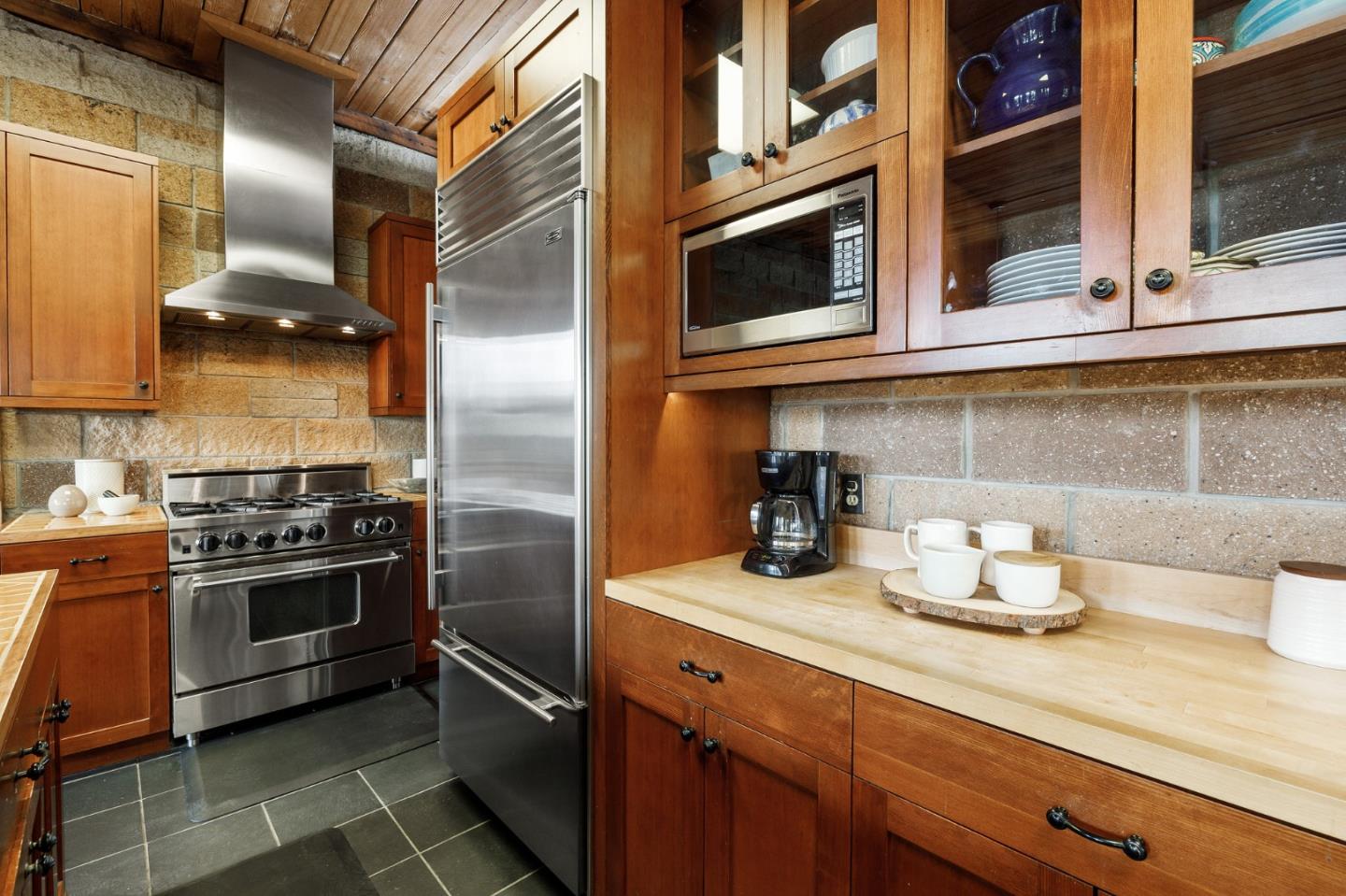 13456 Indian Trail Road Los Gatos, CA 95033 - Photo 33 of 99 a kitchen with stainless steel appliances granite countertop a sink and a stove
