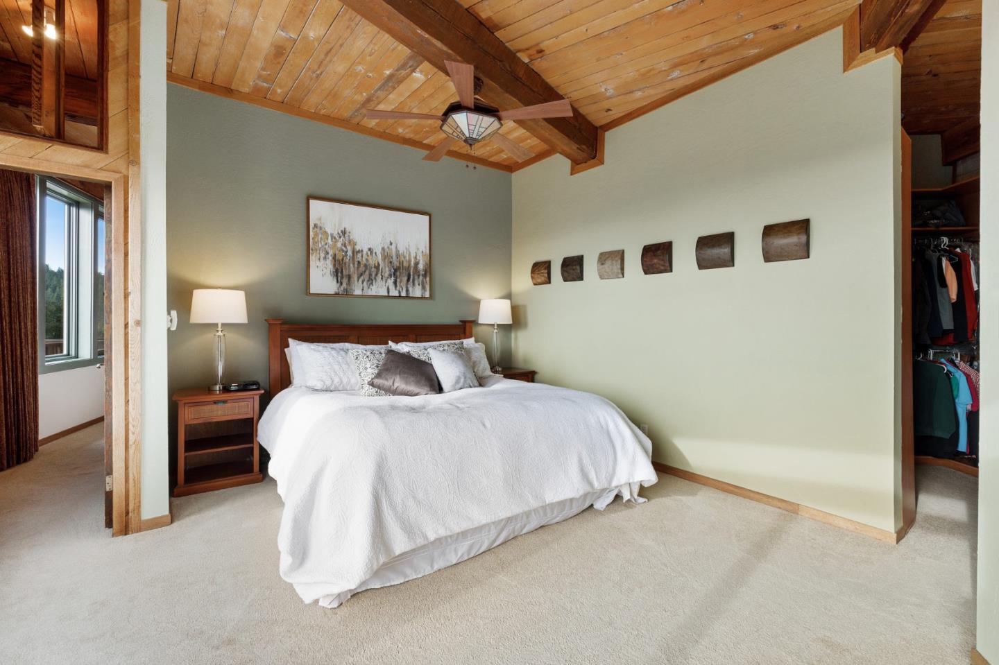 13456 Indian Trail Road Los Gatos, CA 95033 - Photo 39 of 99 a bed room with a bed and a painting on the wall