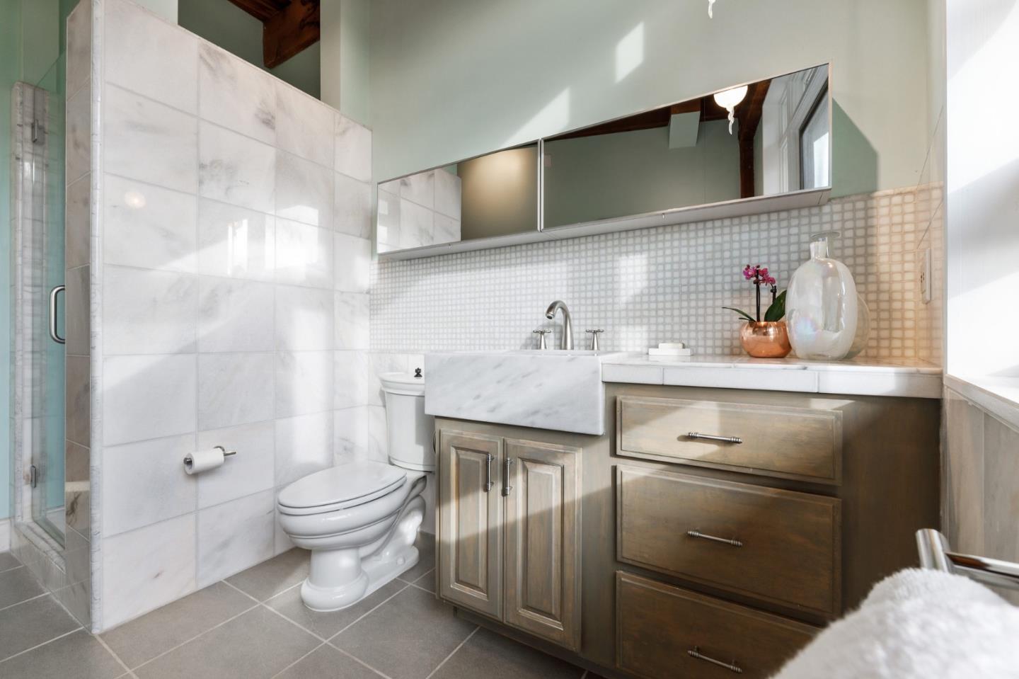 13456 Indian Trail Road Los Gatos, CA 95033 - Photo 45 of 99 a bathroom with a sink a toilet and shower