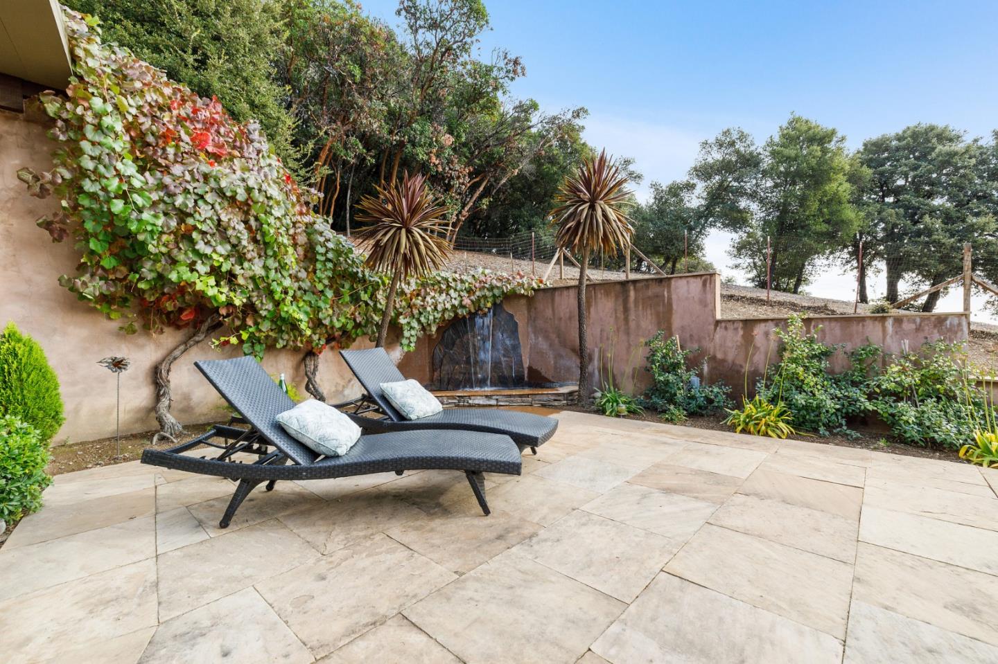 13456 Indian Trail Road Los Gatos, CA 95033 - Photo 47 of 99 a view of a backyard with sitting area and furniture