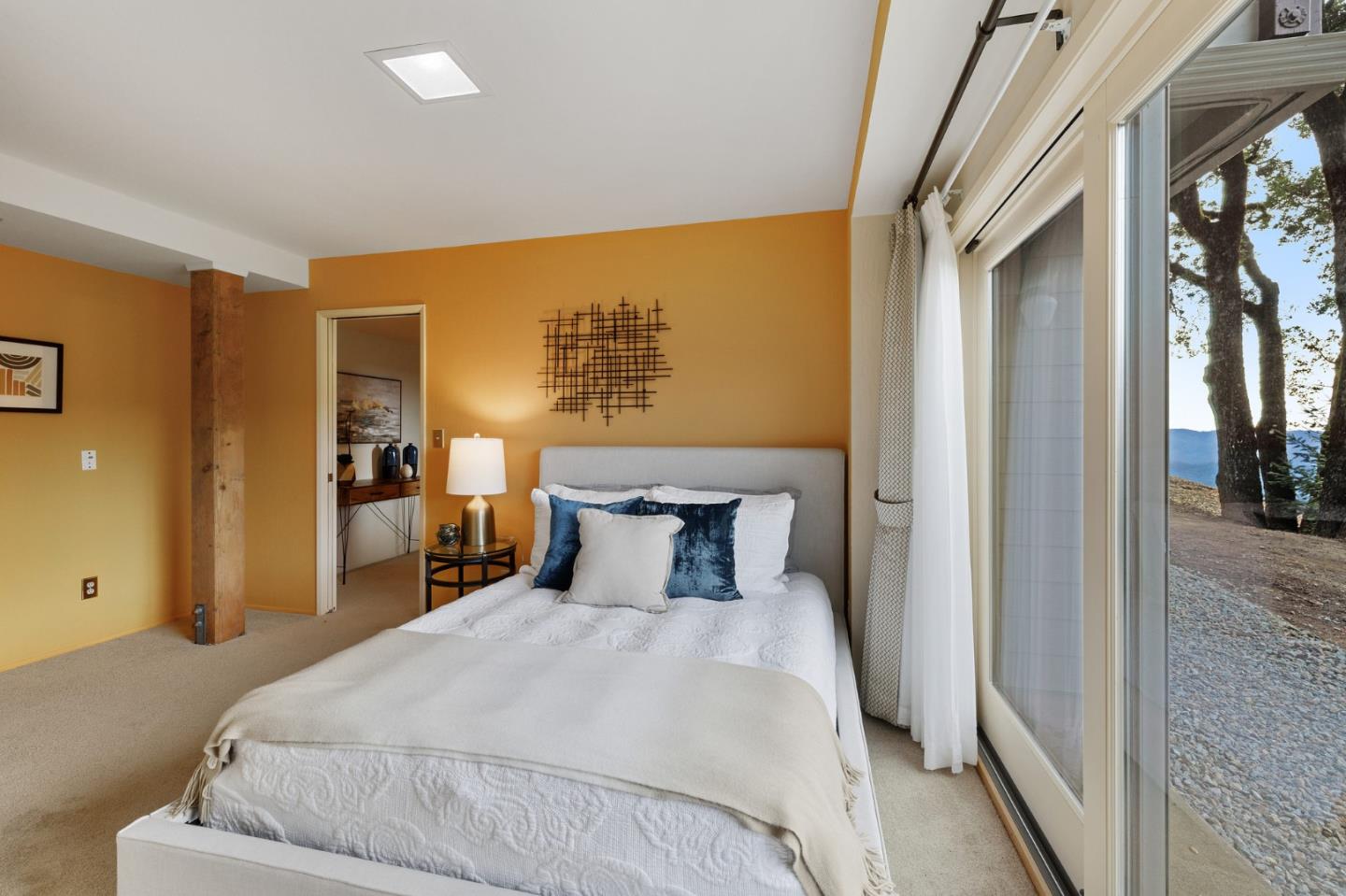 13456 Indian Trail Road Los Gatos, CA 95033 - Photo 60 of 99 a bedroom with a large bed and a large mirror