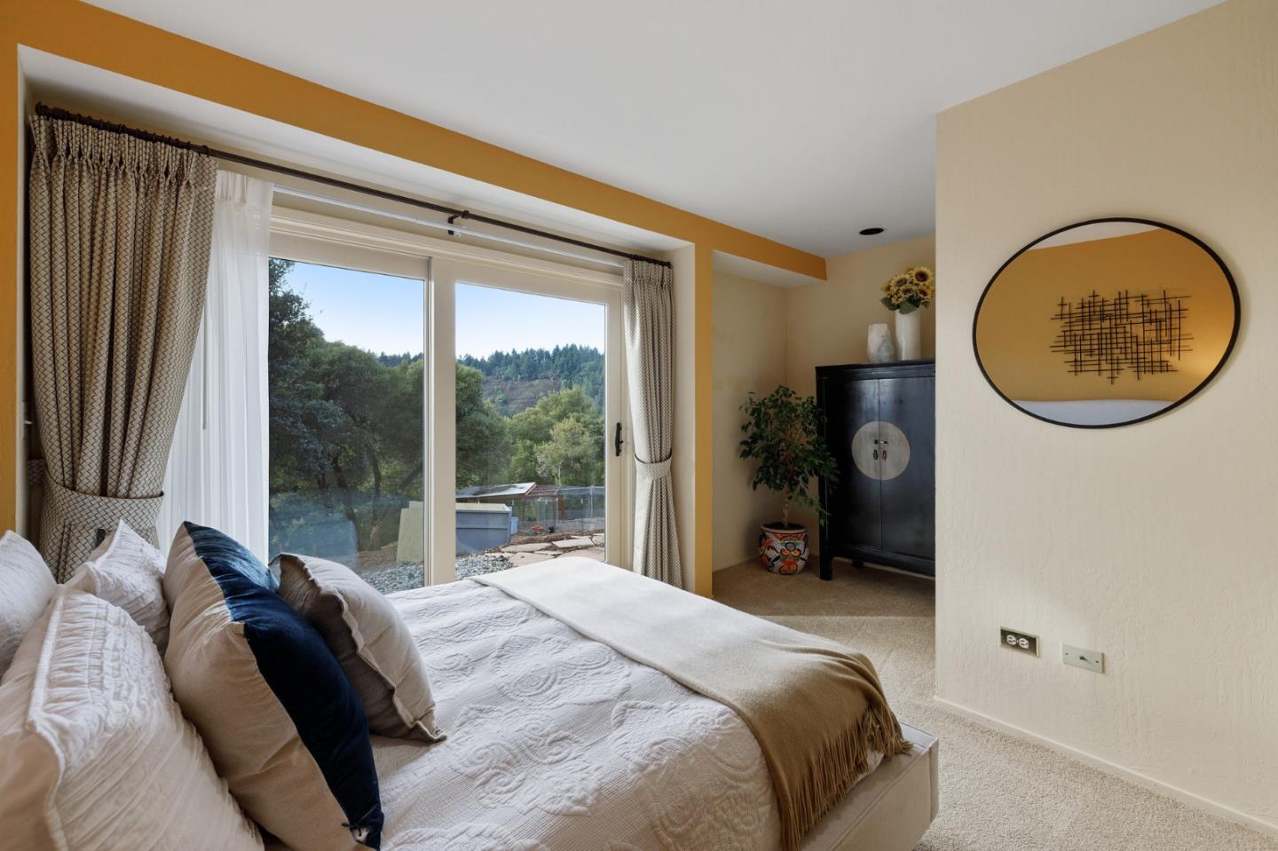 13456 Indian Trail Road Los Gatos, CA 95033 - Photo 61 of 99 a bedroom with a bed and a large window