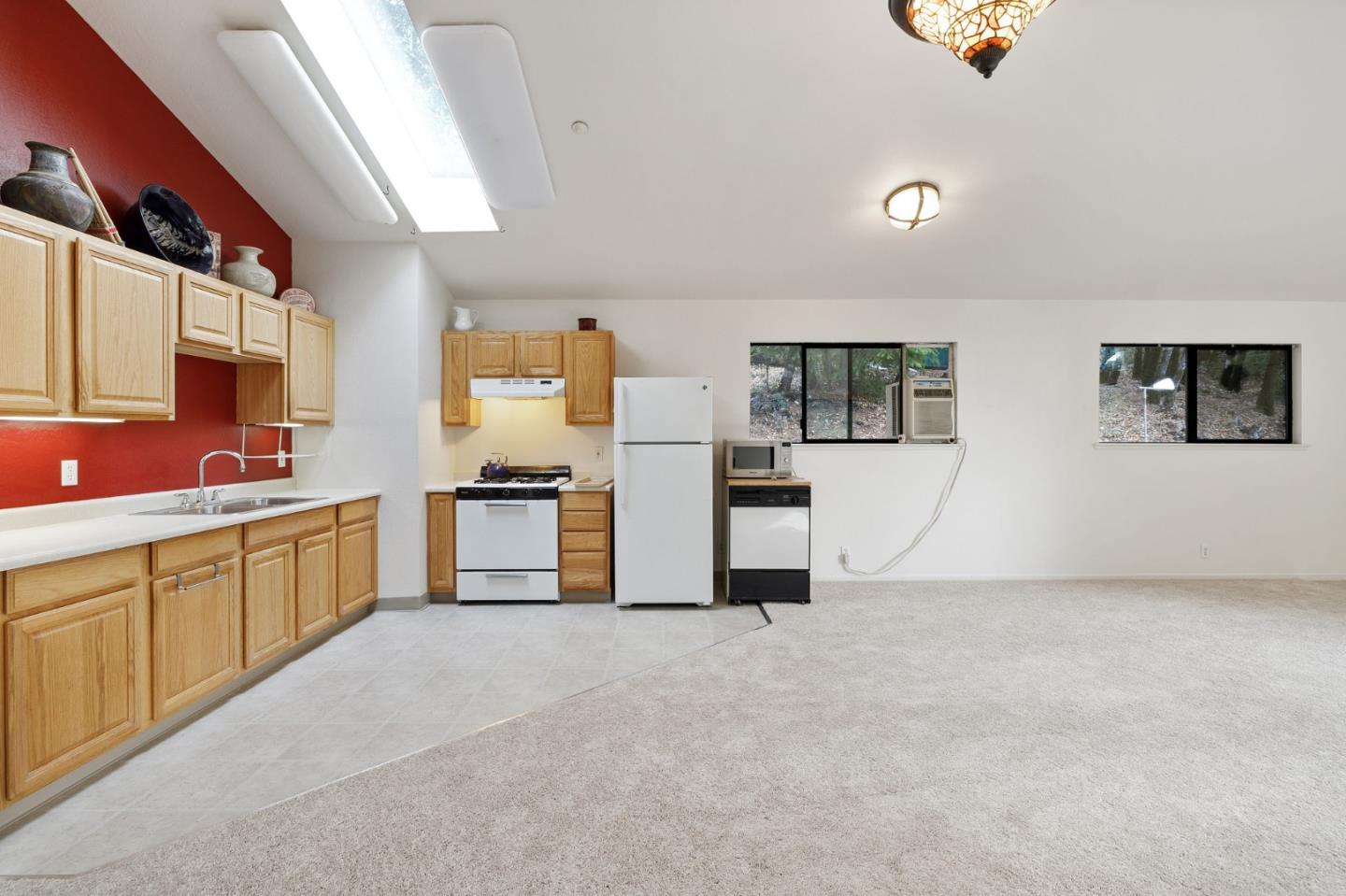 13456 Indian Trail Road Los Gatos, CA 95033 - Photo 92 of 99 a kitchen with stainless steel appliances a refrigerator and a sink