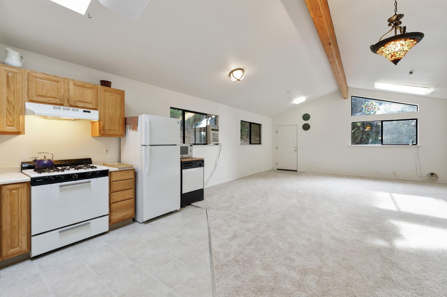 13456 Indian Trail Road Los Gatos, CA 95033 - Photo 95 of 99 a kitchen with stainless steel appliances granite countertop a refrigerator a stove and a sink