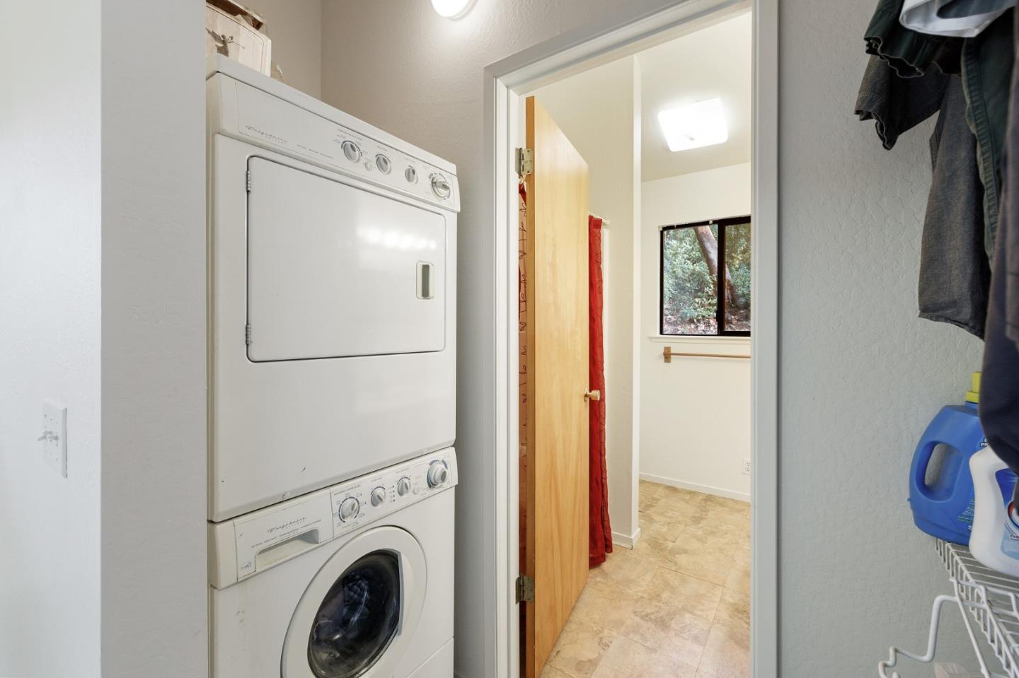 13456 Indian Trail Road Los Gatos, CA 95033 - Photo 97 of 99 a view of a hallway with washer and dryer