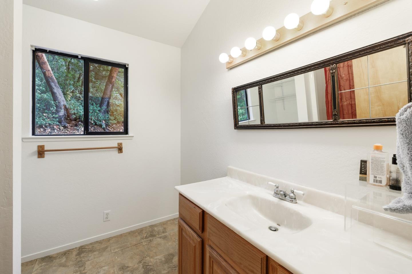 13456 Indian Trail Road Los Gatos, CA 95033 - Photo 98 of 99 a bathroom with a sink and a window