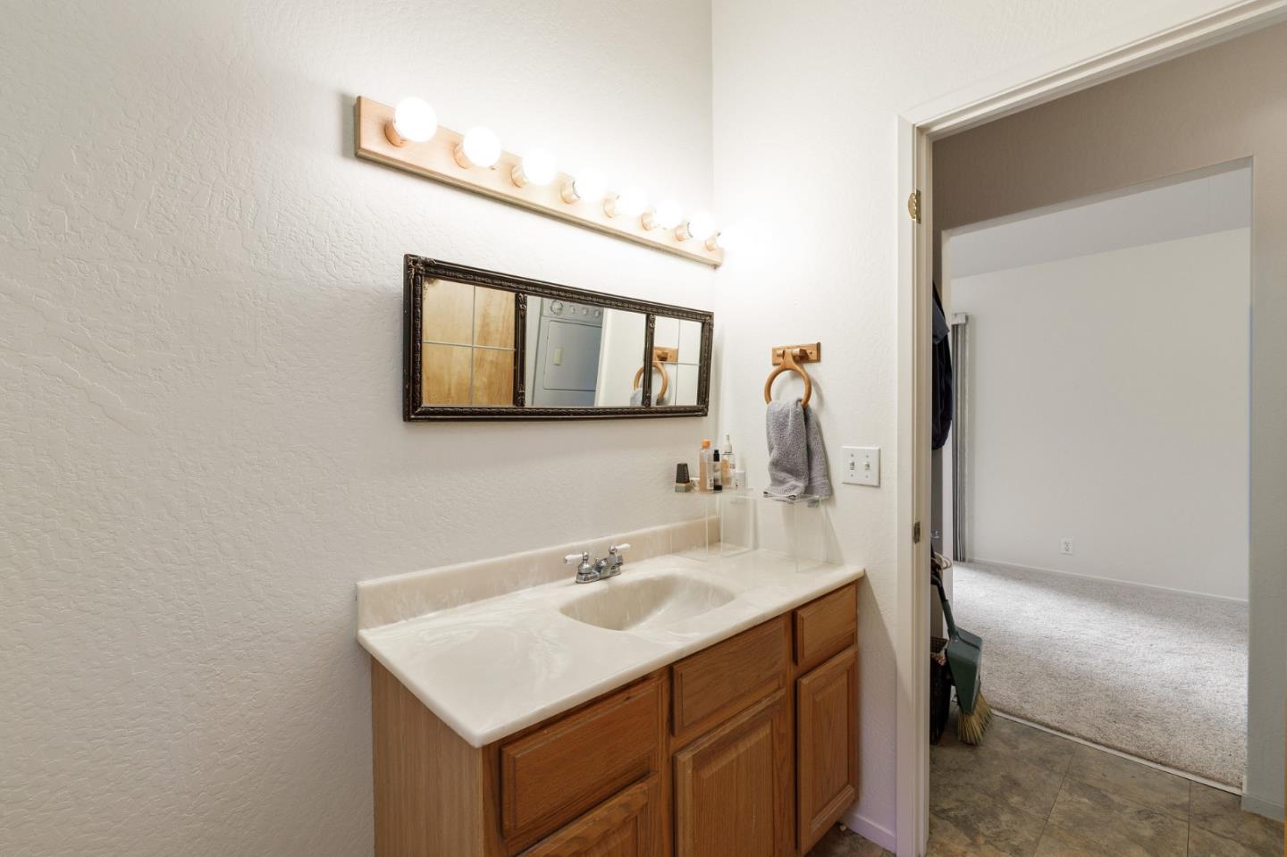 13456 Indian Trail Road Los Gatos, CA 95033 - Photo 99 of 99 a bathroom with a sink vanity and a mirror