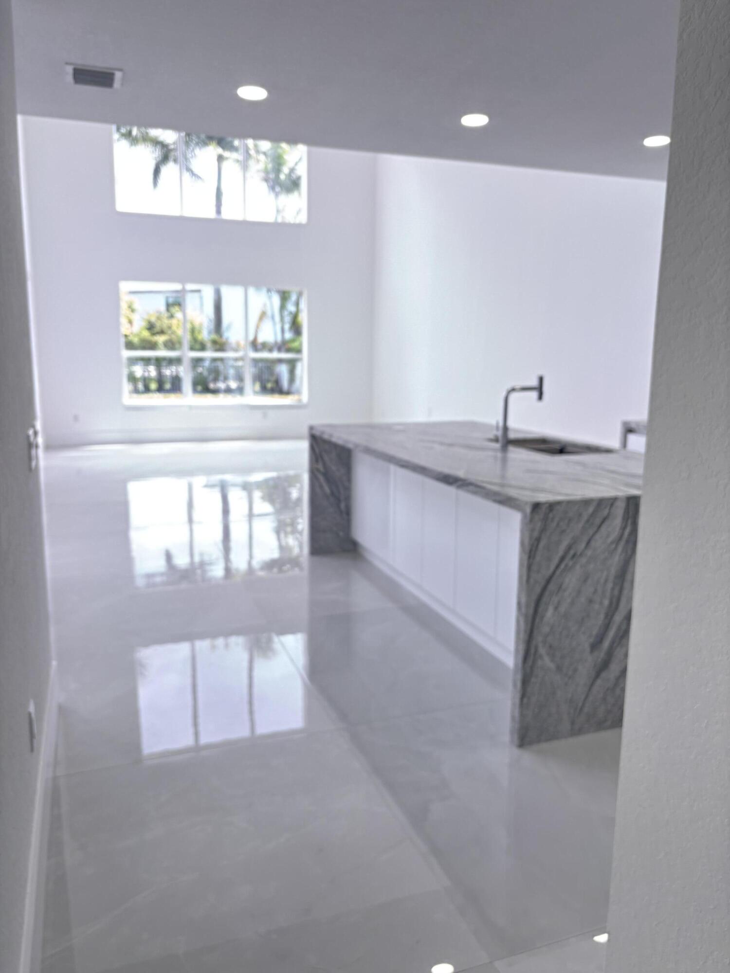 5227 Southwest 195th Terrace Miramar, FL 33029 - Photo 22 of 58 a bathroom with a sink a vanity and a large mirror