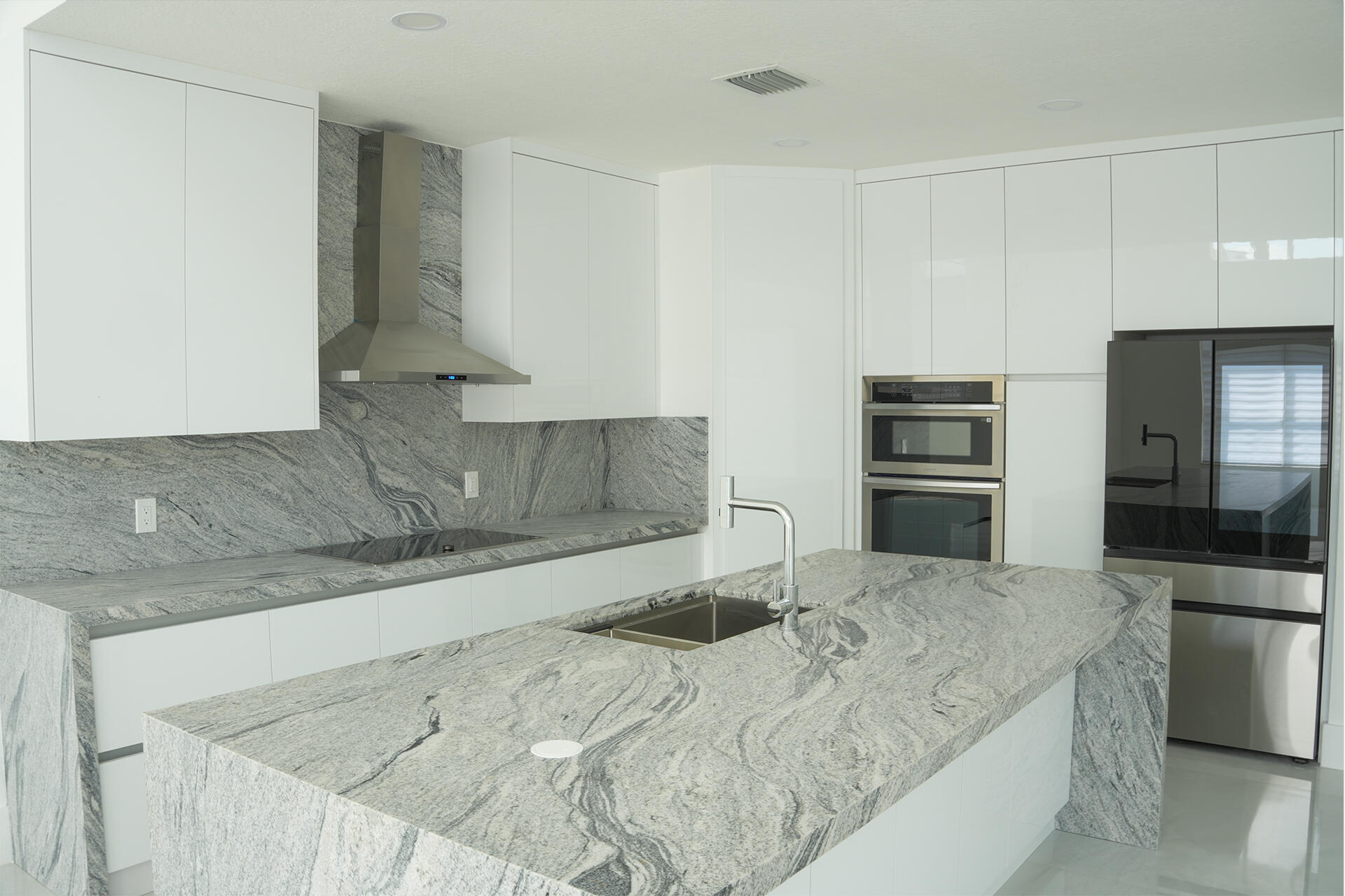 5227 Southwest 195th Terrace Miramar, FL 33029 - Photo 27 of 58 a kitchen with granite countertop a refrigerator and a sink