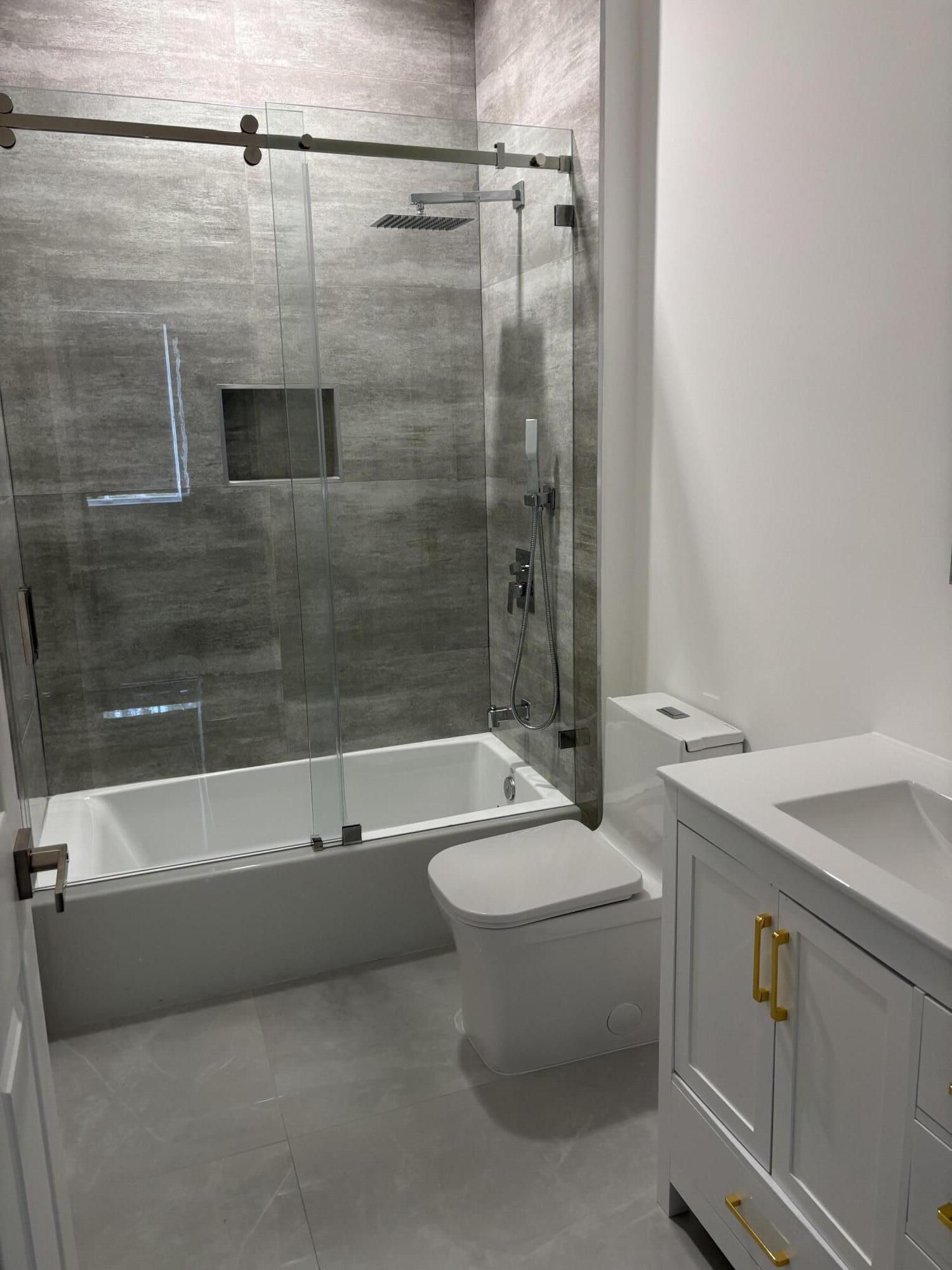 5227 Southwest 195th Terrace Miramar, FL 33029 - Photo 34 of 58 a bathroom with a sink a toilet and shower