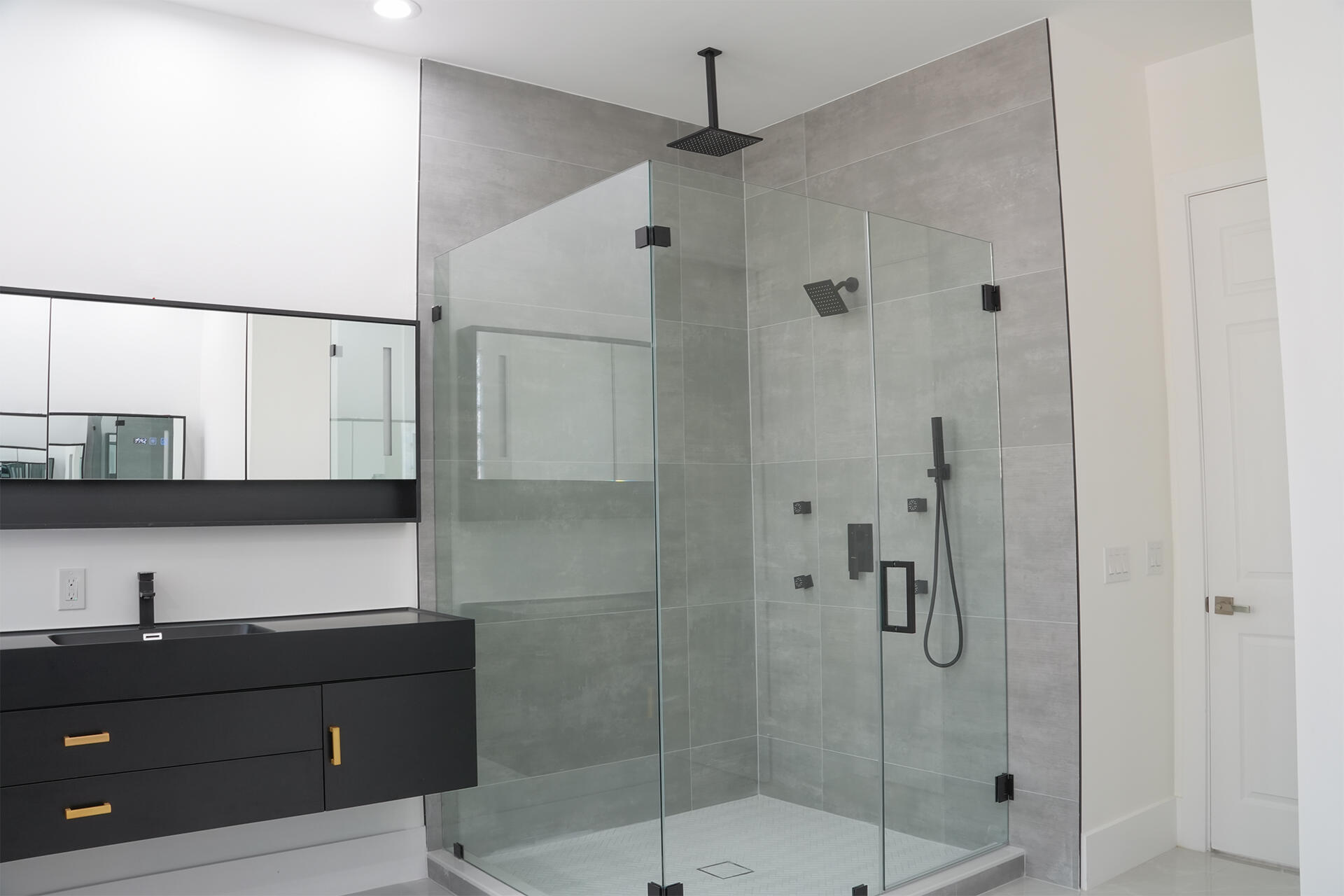 5227 Southwest 195th Terrace Miramar, FL 33029 - Photo 36 of 58 a bathroom with a shower sink and mirror