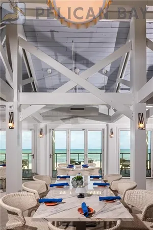 a view of a dining room with furniture wooden floor and chandelier