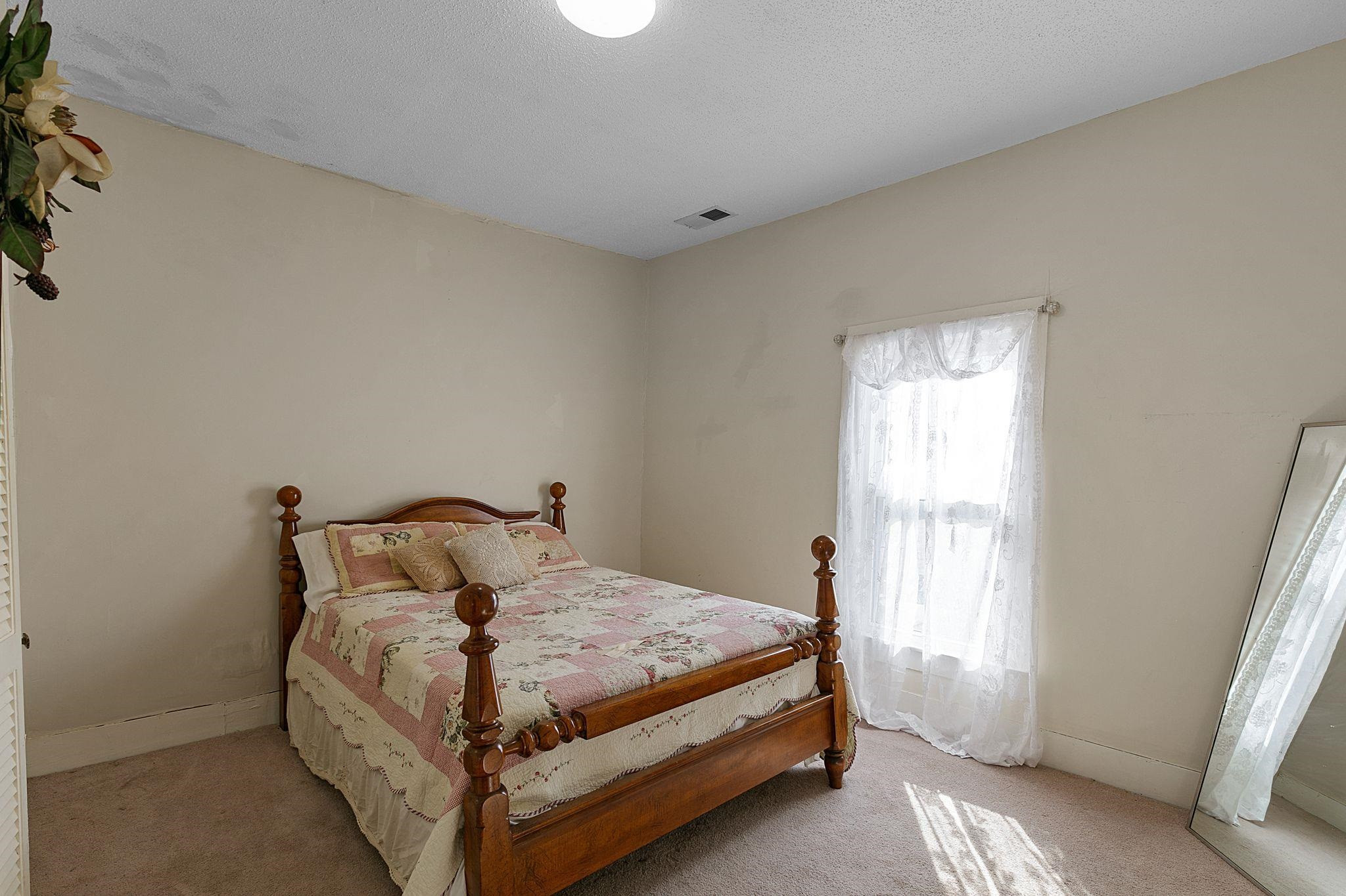 5118 Old Jackson Road Bells, TN 38006 - Photo 12 of 21 a bedroom with a bed and a window
