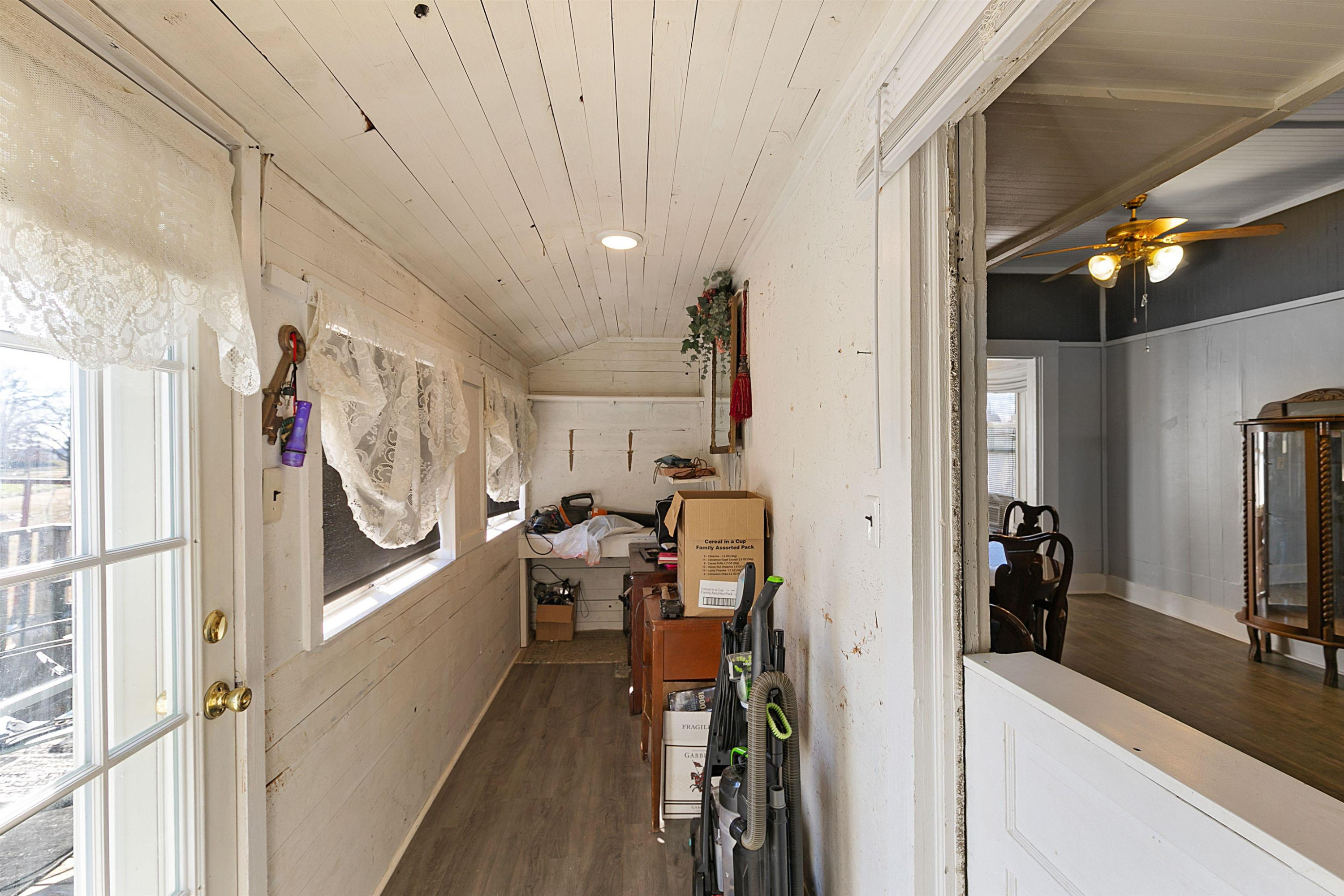 5118 Old Jackson Road Bells, TN 38006 - Photo 18 of 21 a view of a hallway with wooden floor and windows